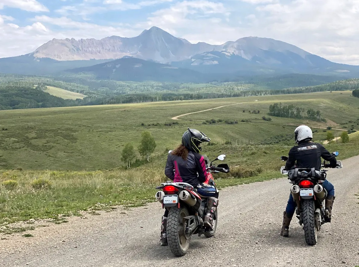 Telluride Motorcycle tours on dirt road with mountain views